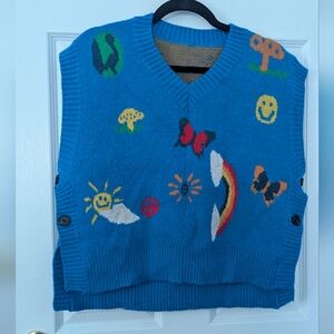 Colorful Blue Knit Vest with Fun Patterns